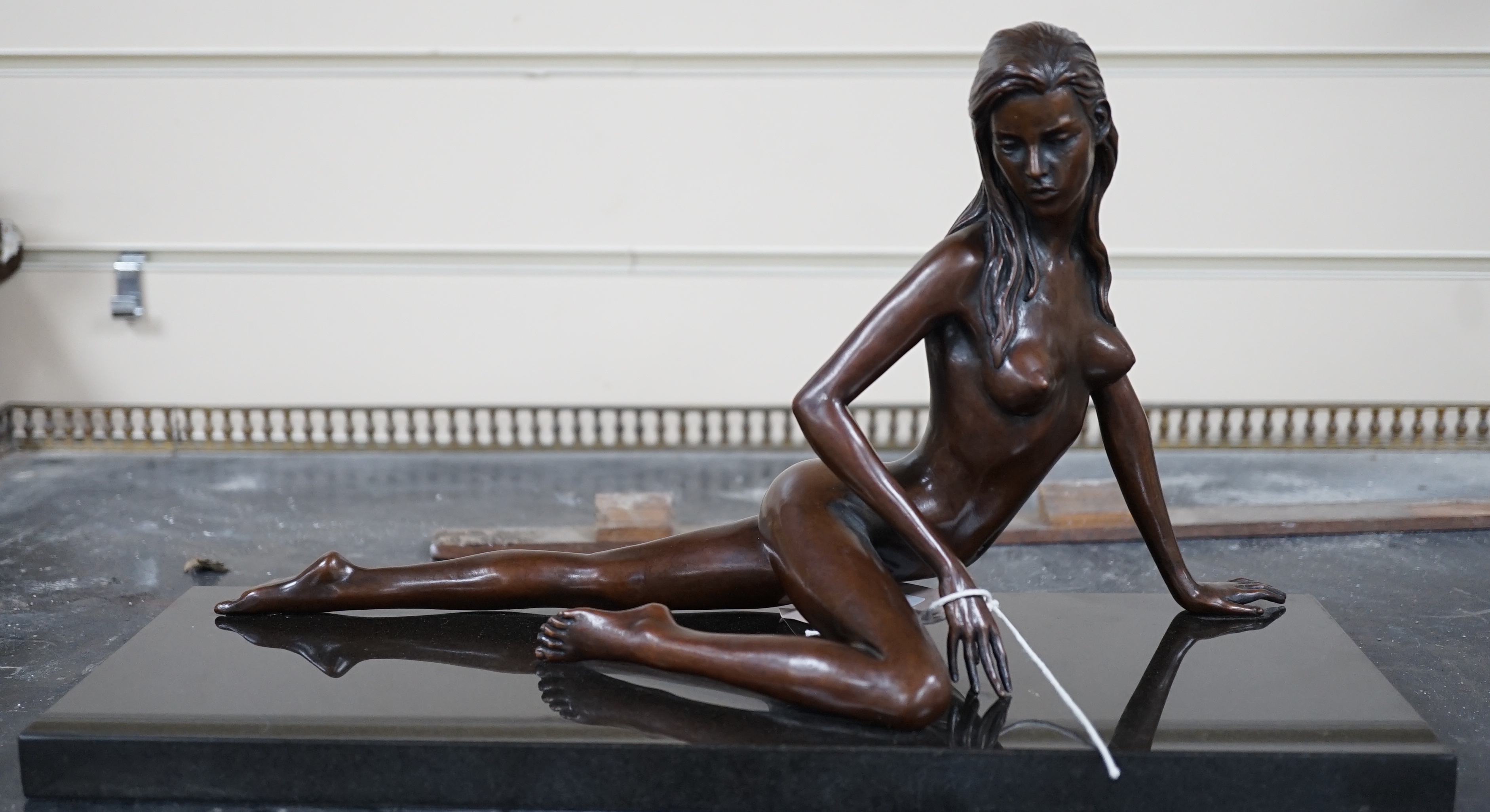 Jonathan Wylder (born 1957). A bronze reclining nude 'Prague', one of edition of eight, 38cm wide, 21cm high